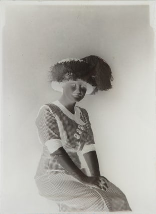 Item #1003403 Four glass plate negatives featuring women in picture hats. FASHION