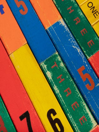 Two sets of painted wooden counting blocks